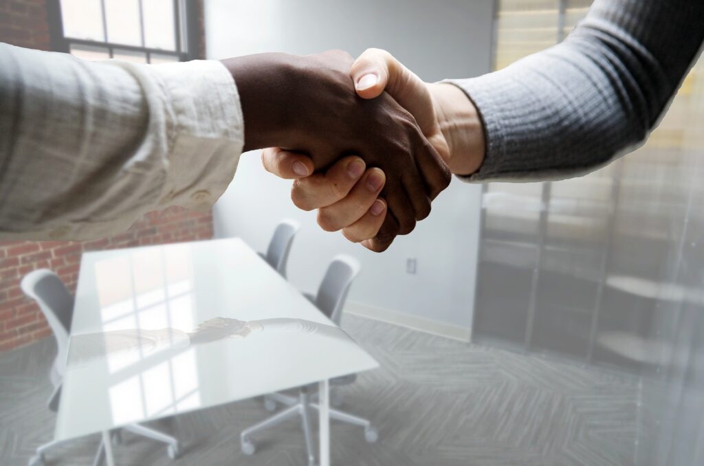 Two male hands shaking in agreement.